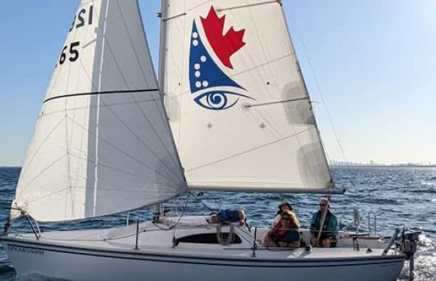 Chris and team sailing upwind